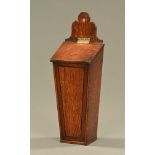 A 19th century oak slope front candle box, ebony strung. Height 49 cm.