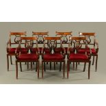 A set of seven Regency style mahogany armchairs, with lyre backs and raised on sabre legs.