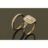 A 9 ct gold diamond cluster ring with diamond set shoulders,