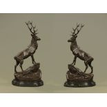 After Moignier a pair of bronze stags, raised on a marble plinth. Height 75 cm, width 40 cm.