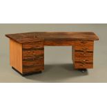 A rosewood veneered desk circa 1970, sold with Cites certificate No. 614226/01.