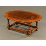 A Titchmarsh & Goodwin oval oak coffee table,