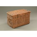 A large wicker log basket. Height 50 cm, width 80 cm, depth 51 cm.