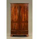 A 19th century Georgian style mahogany linen press. Height 206 cm, width 114 cm, depth 58 cm.