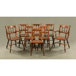 A set of eight reproduction oak kitchen chairs, comprising two arm and six singles,