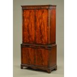 A mahogany reproduction cocktail cabinet,