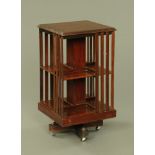 An Edwardian inlaid mahogany square revolving bookcase. Height 88 cm, top 46.5 cm square.