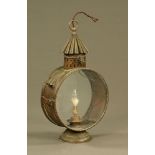 A large 19th century brass Regency style storm lantern of unusual form. Height 59 cm.