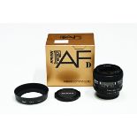 A Nikon AF Nikkor 28 mm f2.8 D lens with box.