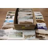 A box full of topographical and other UK postcards