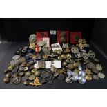 A box of cap badges, buttons, lapel badges etc.