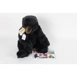 A Bear Bits artist's teddy bear, named "Orion", modelled as a black bear with brown muzzle,