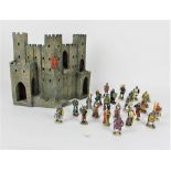 A resin model castle front, together with 22 model knights,