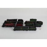 A group of Triang 00 gauge model locomotives and tenders,