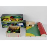 Three Farm World plastic agricultural models, to include a plough,