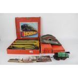 A group of Hornby related 0 gauge models, including boxed and vintage related railway postcards,