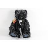 A Charlie bears teddy bear, "Lovely", having a long pile black plush body, with lighter strands,