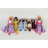 A group of 7 vinyl dolls, to comprise Barbie, and a Uneeda Company hard bodied doll,