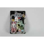 A 1977 Palitoy carded Star Wars Storm Trooper figure, measuring 3 3/4 tall,