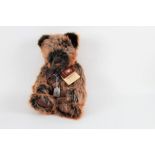 A Charlie bears teddy bear, "Terry", having key pendant and brown organza bow,