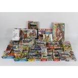 An assorted collection of Airfix model kits of military figures and buildings, some opened,