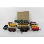 A group of Hornby and Marx 0 gauge model locomotives and rolling stock,