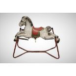 A mid century tin Mobo Prairie King rocking horse,