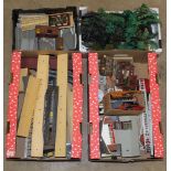 An assorted collection of plastic railway buildings and railway accessories, to include Triang,