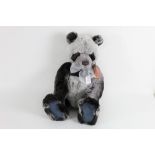 A Charlie bears teddy bear, "Peyton", having a smooth three tone grey plush body,