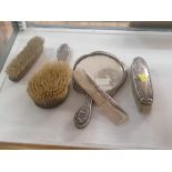 Silver backed items, three brushes,