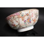 An oriental polychrome bowl depicting figures in vignettes