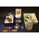 A small quantity of First World War and other medals and badges to include a blue enamelled silver