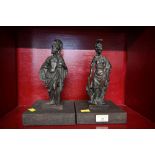 Two bronze metal figural ornaments on wooden bases