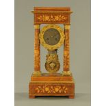 A 19th century continental marquetry portico clock, with two train striking movement.