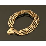 A 9 ct gold gate bracelet with safety chain and padlock, 9.5 grams.