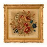 A Victorian stump work picture, roses and other flower heads. 53 cm x 55 cm, in gilt frame.