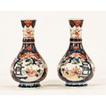 A pair of Chinese Imari club shaped vases, both with drilled bases. Height 23 cm.