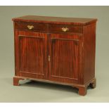 A Victorian mahogany chiffonier, with two drawers above a pair of panelled cupboard doors.