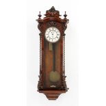 A Victorian walnut single weight Vienna style regulator wall clock. Height 100 cm.