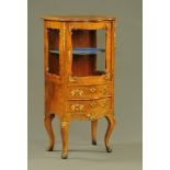 A Victorian walnut side cabinet with serpentine front,