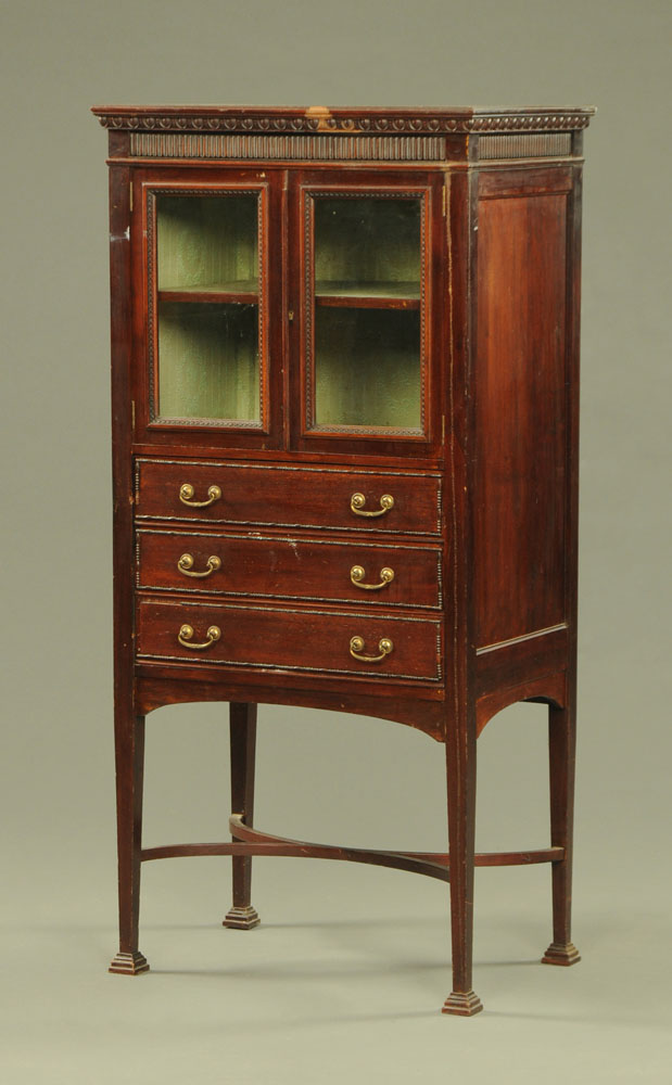 An Edwardian mahogany music cabinet,