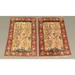 A pair of Eastern silky pile fringed rugs, decorated with various birds,