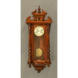 A late 19th century Vienna style regulator wall clock by Gustav Becker, with detachable pediment,