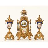A 19th century spelter clock garniture, with Sevres style porcelain panels,