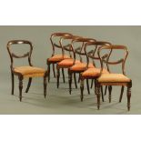 A set of six Victorian rosewood dining chairs, each with bowed top rail, carved mid rail,
