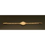A 9 ct gold cased ladies Limit wristwatch, with 9 ct gold bracelet. Gross weight 13.7 grams.