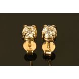A pair of 18 ct yellow gold diamond set stud earrings. Total diamond weight +/- .63 carats.