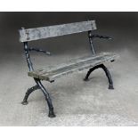 A cast iron garden bench, with slat back and seat. Width 137 cm.