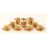 A Japanese Satsuma tea service, comprising 6 cups, 6 saucers, sugar basin, lidded jug and teapot,