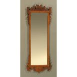 A George III style fretwork wall mirror of large form. Height 150 cm, width 57 cm.